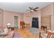 Spacious living room with ceiling fan and wood flooring at 3968 Sw 131St Place Rd, Ocala, FL 34473