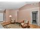 Bright living room showcasing vaulted ceilings, seating, and wood floors with an area rug at 3968 Sw 131St Place Rd, Ocala, FL 34473