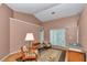 Spacious living room with high ceilings, comfortable seating, and a glass coffee table on a decorative rug at 3968 Sw 131St Place Rd, Ocala, FL 34473