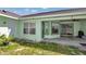 Covered back patio with sliding glass door and exterior door access at 3968 Sw 131St Place Rd, Ocala, FL 34473