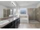 Bathroom features double sink vanity, soaking tub, and glass enclosed shower at 4261 Sw 62Nd Loop, Ocala, FL 34474