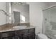 Bathroom featuring granite vanity, toilet, and glass-enclosed shower at 4261 Sw 62Nd Loop, Ocala, FL 34474