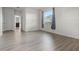 Bright bedroom features laminate flooring, large window with backyard view, and neutral paint at 4261 Sw 62Nd Loop, Ocala, FL 34474