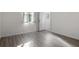 A simple bedroom with hard surface floors and bright window at 4261 Sw 62Nd Loop, Ocala, FL 34474