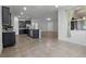 Modern kitchen with dark cabinetry, stainless steel appliances, and a large island at 4261 Sw 62Nd Loop, Ocala, FL 34474