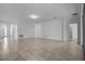 Spacious living room featuring tile floors, neutral walls, and access to kitchen at 4261 Sw 62Nd Loop, Ocala, FL 34474