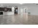 Open-concept living space featuring tile floors and an adjacent kitchen with stainless steel appliances at 4261 Sw 62Nd Loop, Ocala, FL 34474