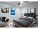 Stylish bedroom features a modern chair and a large window offering a scenic outdoor view at 8900 Sw 138Th Ln, Ocala, FL 34473