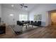 Bright living room featuring modern decor, hardwood floors, neutral paint, and ample natural light at 8900 Sw 138Th Ln, Ocala, FL 34473
