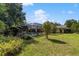 Expansive backyard with enclosed pool area and mature shade trees at 2135 Se 12Th St, Ocala, FL 34471