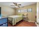 Bedroom with hardwood floors, a window, and a ceiling fan at 2135 Se 12Th St, Ocala, FL 34471