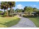 Charming single-story home featuring a long driveway, mature landscaping and inviting curb appeal at 2135 Se 12Th St, Ocala, FL 34471
