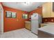 Bright kitchen featuring tile floors, light wood cabinets, and windows at 2135 Se 12Th St, Ocala, FL 34471