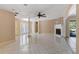 Bright living room boasts a stone fireplace, recessed lighting, and large windows overlooking the backyard at 2135 Se 12Th St, Ocala, FL 34471