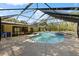 Enclosed pool area with direct access to indoor living spaces and outdoor patio at 2135 Se 12Th St, Ocala, FL 34471