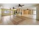 Bright sunroom offers tile floors, multiple ceiling fans and access to the backyard at 2135 Se 12Th St, Ocala, FL 34471