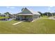 Exterior of two-story home featuring a gray facade, covered front porch and large front yard at 3943 Nw 219Th Street Rd, Micanopy, FL 32667