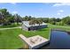 Stunning aerial view of house with a private dock with an outdoor seating area on waterfront property at 3943 Nw 219Th Street Rd, Micanopy, FL 32667