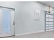 Interior of garage with sectional door, garage door opener and entry door at 3943 Nw 219Th Street Rd, Micanopy, FL 32667