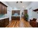 Spacious open kitchen with dark wood cabinets, hardwood floors and stainless steel appliances at 3943 Nw 219Th Street Rd, Micanopy, FL 32667