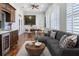 Sunlit living room with large windows, comfortable seating, dining area, and modern decor at 3943 Nw 219Th Street Rd, Micanopy, FL 32667