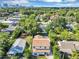Aerial view showcasing a two-story home surrounded by lush greenery and neighborhood views at 716 Golfview St, Orlando, FL 32804
