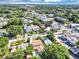 Aerial view showcasing a two-story home surrounded by lush greenery and neighborhood views at 716 Golfview St, Orlando, FL 32804
