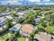 Aerial view showcasing a two-story home surrounded by lush greenery and neighborhood views at 716 Golfview St, Orlando, FL 32804