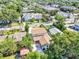 Aerial view showcasing a two-story home surrounded by lush greenery and neighborhood views at 716 Golfview St, Orlando, FL 32804