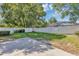 Well-maintained backyard with green grass and white fence provides privacy at 716 Golfview St, Orlando, FL 32804