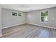 Large bedroom featuring modern flooring, a ceiling fan and bright windows at 716 Golfview St, Orlando, FL 32804