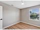Cozy room with natural light, modern flooring and neutral wall, complete with ceiling fan at 716 Golfview St, Orlando, FL 32804