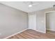 Neutral bedroom with ceiling fan, closet, and light gray walls offers a serene atmosphere at 716 Golfview St, Orlando, FL 32804