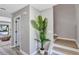Bright entryway featuring a staircase, a side door, and a decorative plant at 716 Golfview St, Orlando, FL 32804