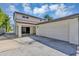 Two-story home featuring attached garage, covered patio, and well-maintained landscaping at 716 Golfview St, Orlando, FL 32804