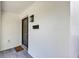 Inviting front porch featuring stylish tile flooring, a modern light fixture, and a mailbox at 716 Golfview St, Orlando, FL 32804