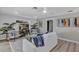 Bright living room features stylish decor, light wood floors, comfortable seating, and a ceiling fan at 716 Golfview St, Orlando, FL 32804
