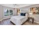 Inviting main bedroom featuring serene decor, a ceiling fan and large windows at 716 Golfview St, Orlando, FL 32804