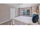 Main bedroom with a ceiling fan, closet and large windows at 716 Golfview St, Orlando, FL 32804