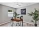 Comfortable office space with a wooden desk, house plants, and a ceiling fan at 716 Golfview St, Orlando, FL 32804