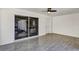 Patio featuring gray tiling, fan, and view of living area through sliding glass doors at 716 Golfview St, Orlando, FL 32804
