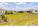 Wide-open backyard with lush green grass, showing a peaceful and expansive outdoor space at 8925 Sw 76Th St, Ocala, FL 34481