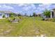 Lush green backyard featuring landscaping, manicured lawn and view of neighboring properties at 8925 Sw 76Th St, Ocala, FL 34481