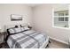Cozy bedroom featuring a comfortable bed, side tables and a window providing natural light at 8925 Sw 76Th St, Ocala, FL 34481
