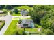 Beautiful home with a screened-in pool, lush lawn, and mature trees providing privacy and serenity at 5005 Se 47Th Terrace Rd, Ocala, FL 34480