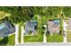 Overhead view of homes in a quiet neighborhood, lush trees, and green lawns at 5005 Se 47Th Terrace Rd, Ocala, FL 34480