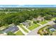 Aerial view of a home with mature trees and a well-manicured lawn at 5005 Se 47Th Terrace Rd, Ocala, FL 34480