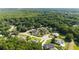 Aerial view of homes surrounded by lush green trees, showcasing the neighborhood's beauty and tranquility at 5005 Se 47Th Terrace Rd, Ocala, FL 34480