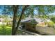 A private screened-in pool and verdant yard make for a relaxing backyard oasis in this lovely home at 5005 Se 47Th Terrace Rd, Ocala, FL 34480