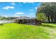 Beautiful backyard with a screened-in pool and lush green lawn at 5005 Se 47Th Terrace Rd, Ocala, FL 34480